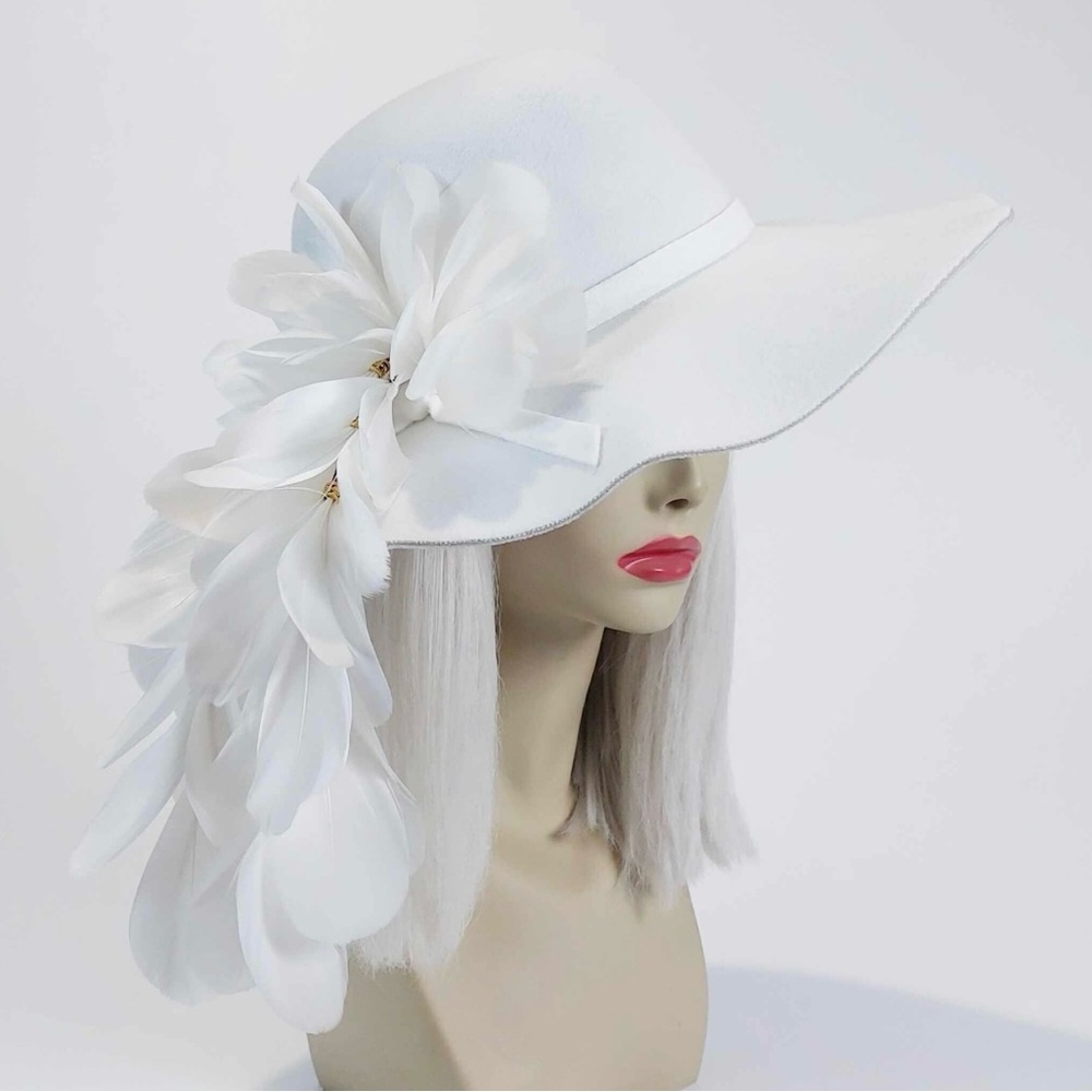 The ‘Vixen and Fox’ Hat handcrafted feather with bohemian beads on suede cord.
